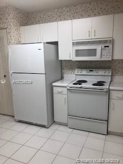 9525 Weldon Cir-Unit -H309 in Tamarac, FL - Building Photo