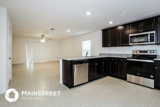 1674 Hideaway Flat St in Mascotte, FL - Building Photo - Building Photo