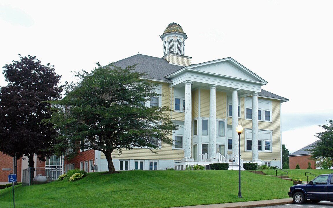 Alumni Hall Apartments in Springvale, ME - Building Photo