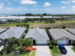 2730 NE Breezeway Cir in Ocean Breeze, FL - Building Photo - Building Photo