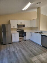 1167 SW Curtis St in Port St. Lucie, FL - Foto de edificio - Building Photo