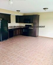 409 S Darrowby Dr in Raymore, MO - Building Photo - Building Photo