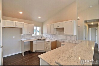 Excellent 3-Bedroom Home in Evans With Great Backyard & Attached Garage! in Evans, CO - Building Photo - Building Photo