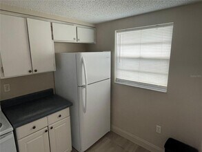 4128 Shoreline Dr, Unit 401 in New Port Richey, FL - Foto de edificio - Building Photo