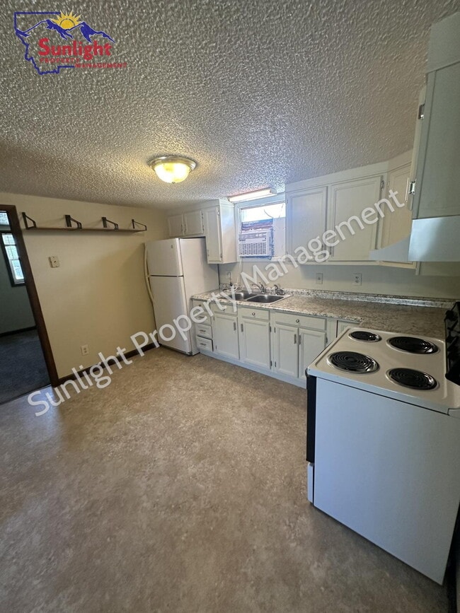 property at 302 E 1st St