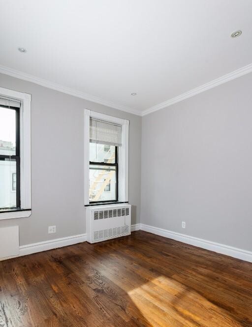 property at 213 E 26th St