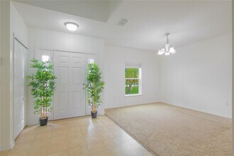 6147 NW Butterfly Orchid Pl in Port St. Lucie, FL - Building Photo - Building Photo