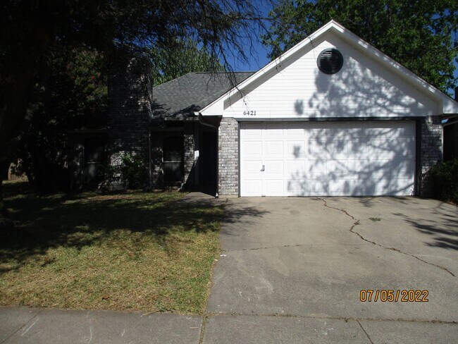 property at 6421 Woodcreek Trail