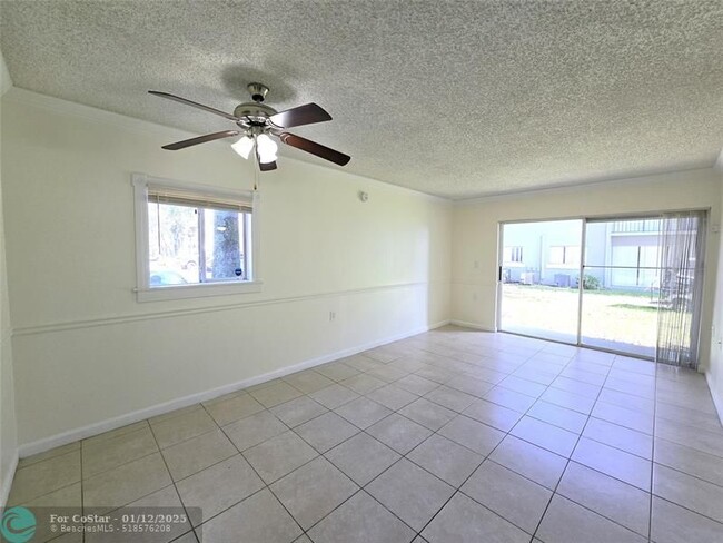 1056 Benoist Farms Rd in Royal Palm Beach, FL - Building Photo - Building Photo