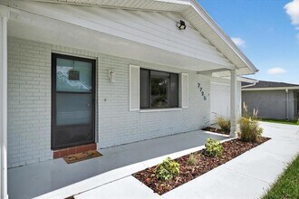 7725 Summertree Ln, Unit L402003D in New Port Richey, FL - Building Photo - Building Photo