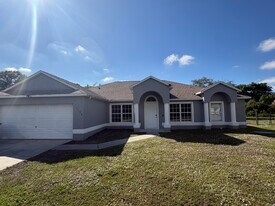 1196 SE Puritan Ln in Port St. Lucie, FL - Building Photo