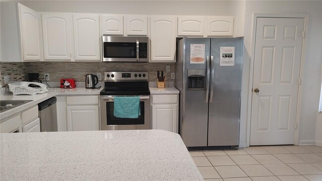 7751 Basnett Cir in Kissimmee, FL - Building Photo - Building Photo