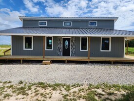 386 Rd 591701 in Cleveland, TX - Building Photo