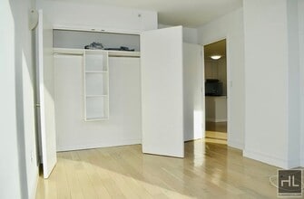 Rent stabilized 1 bedroom spanning 725 sq in Queens, NY - Building Photo - Building Photo