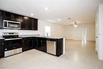 1677 Hideaway Flat St in Mascotte, FL - Building Photo - Building Photo