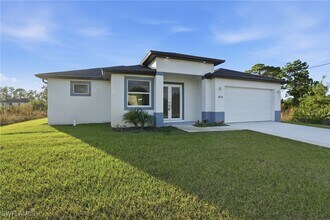 406 Genoa Ave S in Lehigh Acres, FL - Building Photo - Building Photo