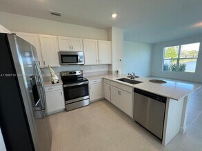 6931 Harbours Edge Ave in Greenacres, FL - Building Photo - Building Photo