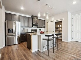 6153 N Ceylon St, Unit 10-303 in Denver, CO - Building Photo