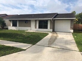 5862 Triphammer Rd in Greenacres, FL - Building Photo