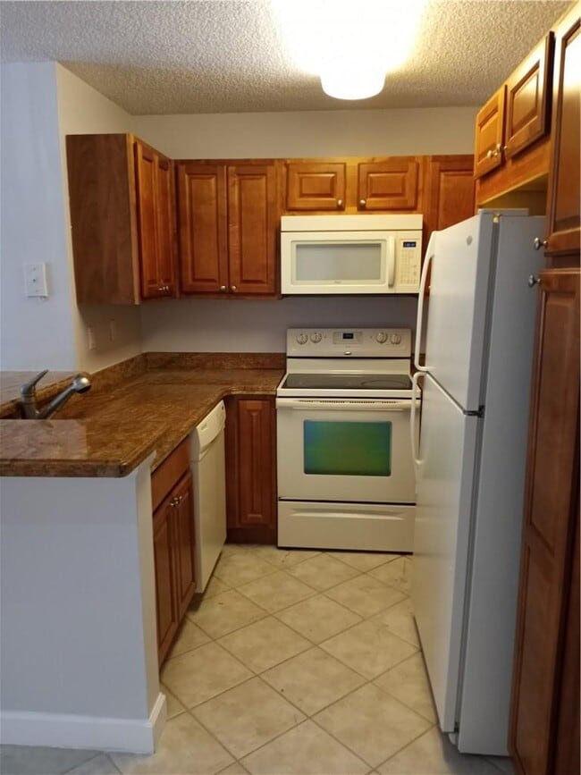 641 Lyons Rd in Coconut Creek, FL - Building Photo - Building Photo