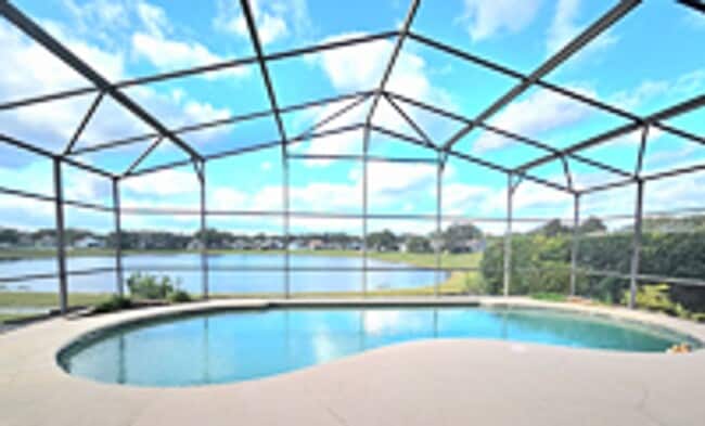 Lakefront home very spacious with a screened in pool in Heathrow in Lake Mary, FL - Building Photo - Building Photo