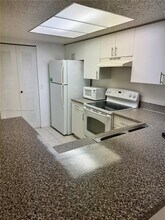 5055 Wiles Rd in Coconut Creek, FL - Building Photo - Building Photo