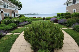 62 Canoe Place Rd in Hampton Bays, NY - Building Photo