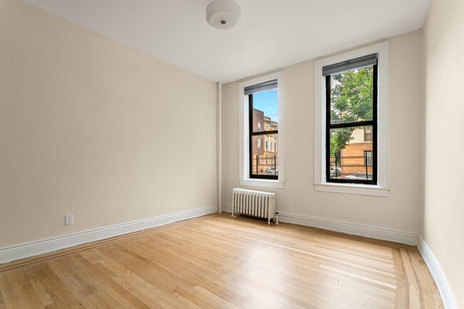 property at 52-25 Skillman Ave