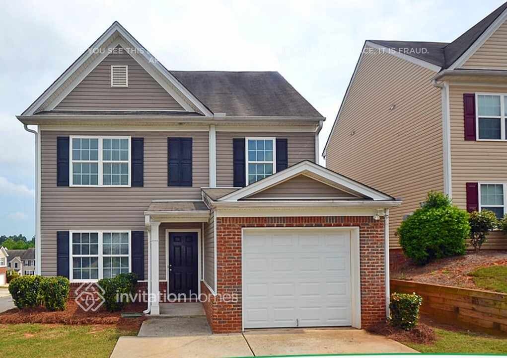 1447 Alcovy Falls Dr SE in Lawrenceville, GA - Building Photo