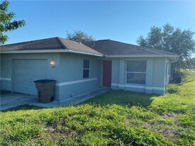 1127 Gilbert Ave S in Lehigh Acres, FL - Building Photo