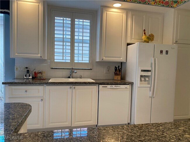 3941 Isla Ciudad Ct in Naples, FL - Foto de edificio - Building Photo