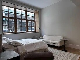 100 Vandam St in New York, NY - Building Photo