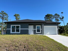 1221 Ecstasy St E in Lehigh Acres, FL - Building Photo