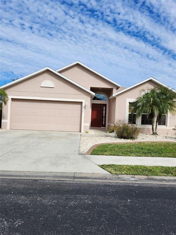 property at 2735 Suncoast Lakes Blvd