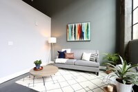 2BR, 2BA - 875 SF - Oak - Living Room - Bradford Mills Lofts Apartamentos in Louisville, Kentucky