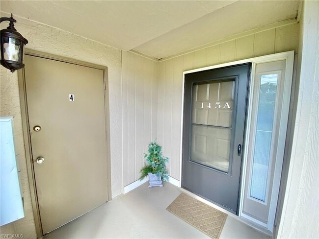 145 Cypress Way E, Unit A in Naples, FL - Building Photo - Building Photo