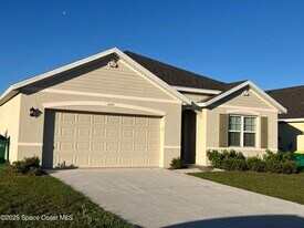 3469 Burrowing Owl Dr in Mims, FL - Building Photo