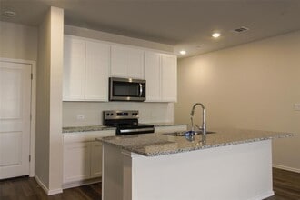 12810 Siena Vlg Ln in Mustang Ridge, TX - Building Photo - Building Photo