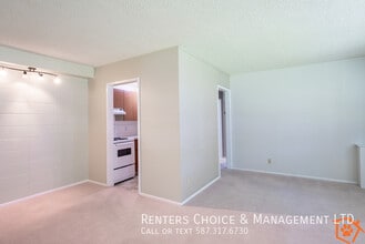 Main Floor Unit Secured Entry, Elevator, Gas & Water Included in Lethbridge, AB - Building Photo - Building Photo