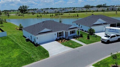 2440 BOWLING Ter in Okahumpka, FL - Building Photo - Building Photo