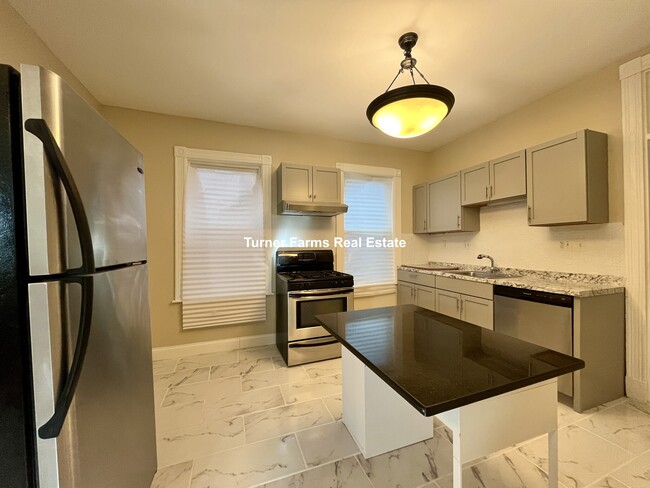 10 Bucknam St, Unit 1 in Boston, MA - Building Photo - Building Photo