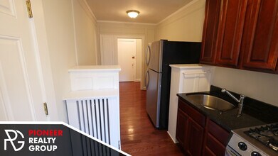 544 W Surf St, Unit 544-E1 in Chicago, IL - Building Photo - Building Photo