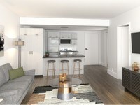 Two bedroom unit kitchen and living room with a modern flair - The Hamilton Midtown Detroit Apartments in Detroit, Michigan