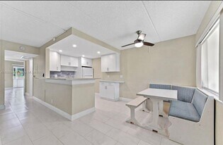 100 Village Green Cir E in Palm Springs, FL - Building Photo