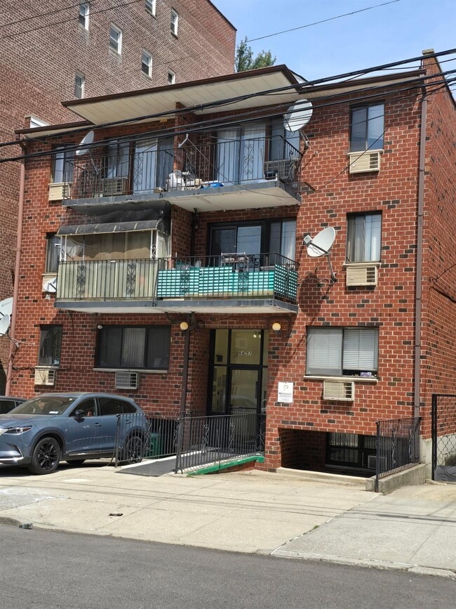 property at 64-57 Wetherole St