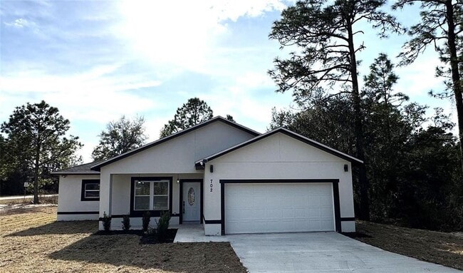 property at 702 Marion Oaks Manor