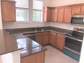 690 Pacific Grove Dr in West Palm Beach, FL - Building Photo - Building Photo