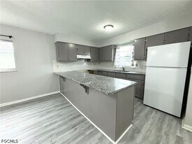 1720 SE Santa Barbara Pl in Cape Coral, FL - Building Photo