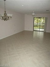 10011 Maddox Ln, Unit A201 in Bonita Springs, FL - Building Photo - Building Photo