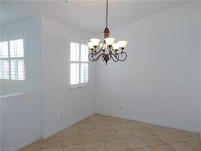 1425 Mariposa Cir-Unit -203 in Naples, FL - Building Photo - Building Photo